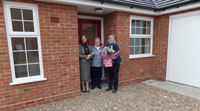 Sales Team at Curtis Fields hand over keys to first resident to move in on new phase